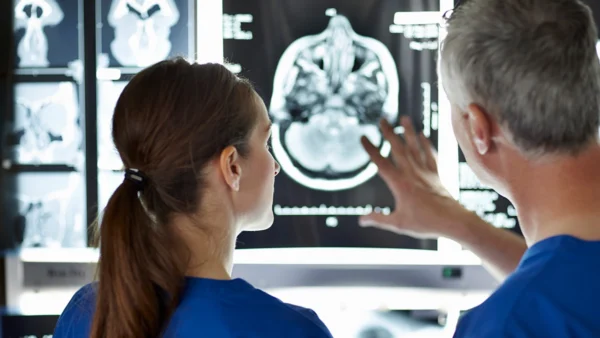 doctor pointing to brain scan