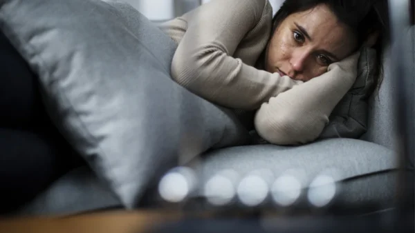 anxious woman on pillows